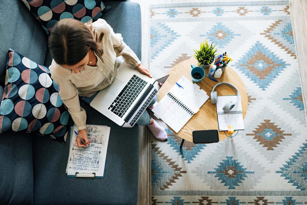 Young businesswoman at home having video call and telecommuting