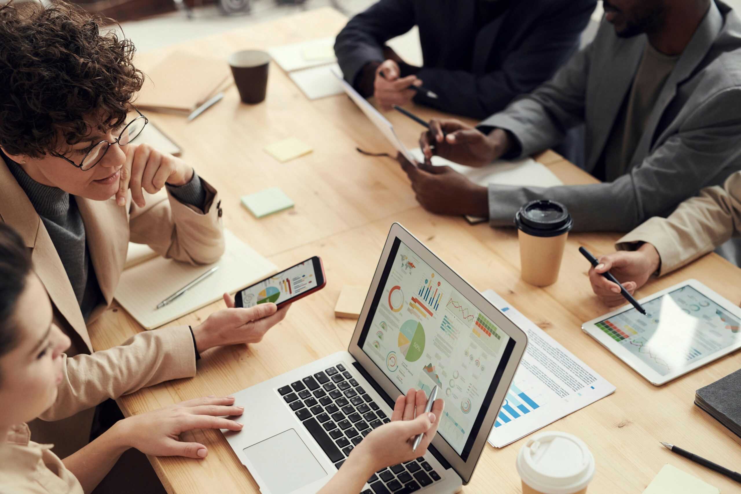 Group of workers at conference table collaborating