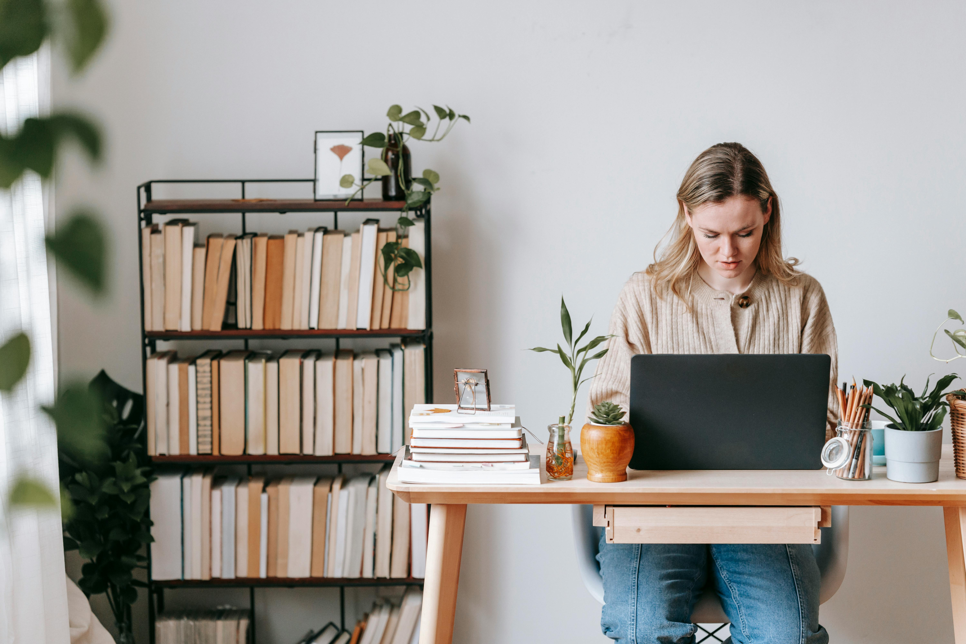 Woman working on laptop from home office
