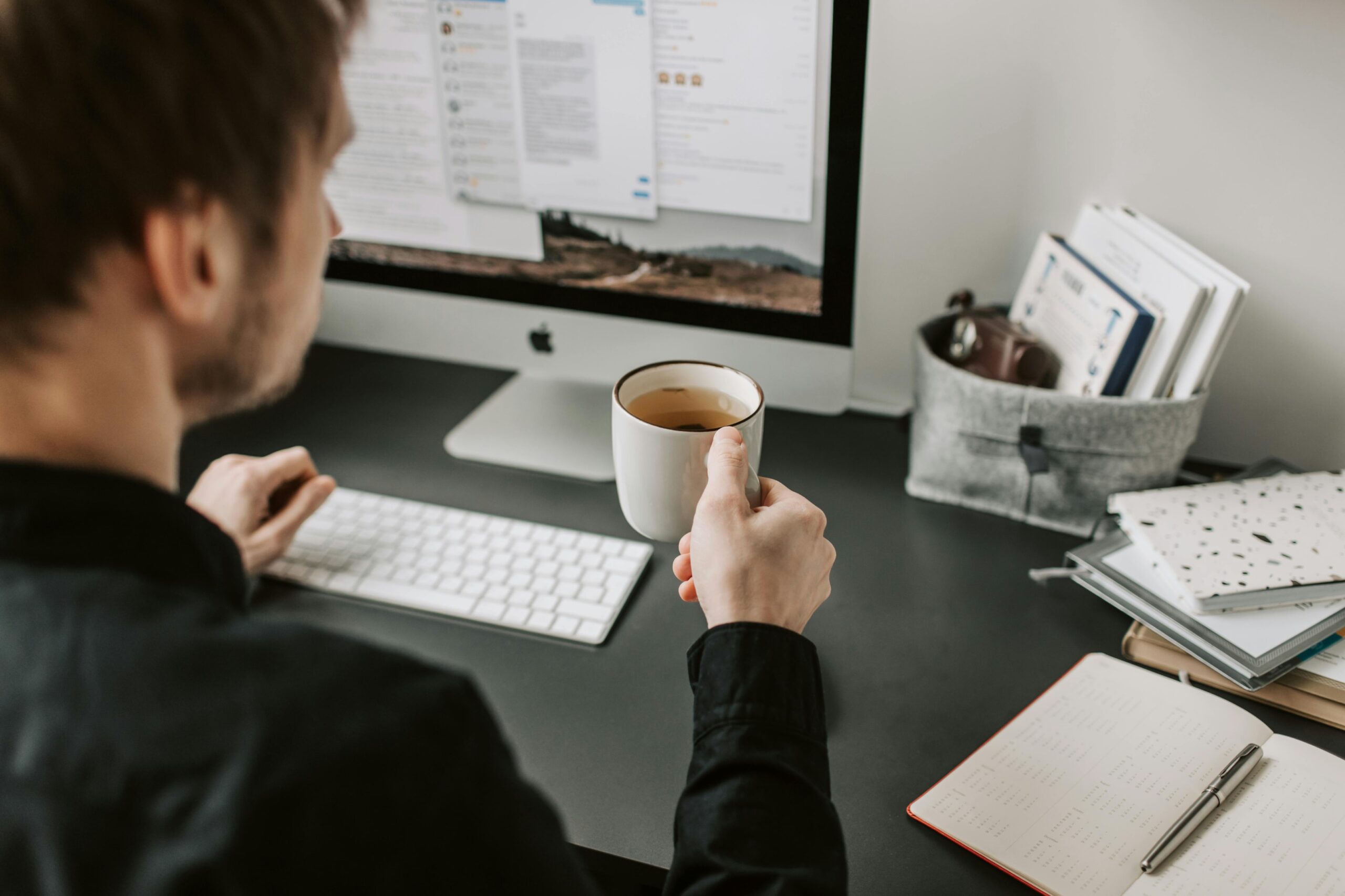 Man sitting at desk working remotely
