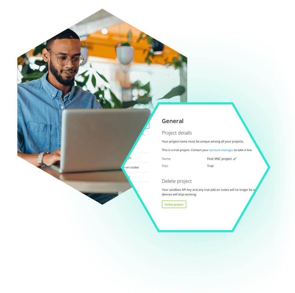 Man with laptop showing project details file