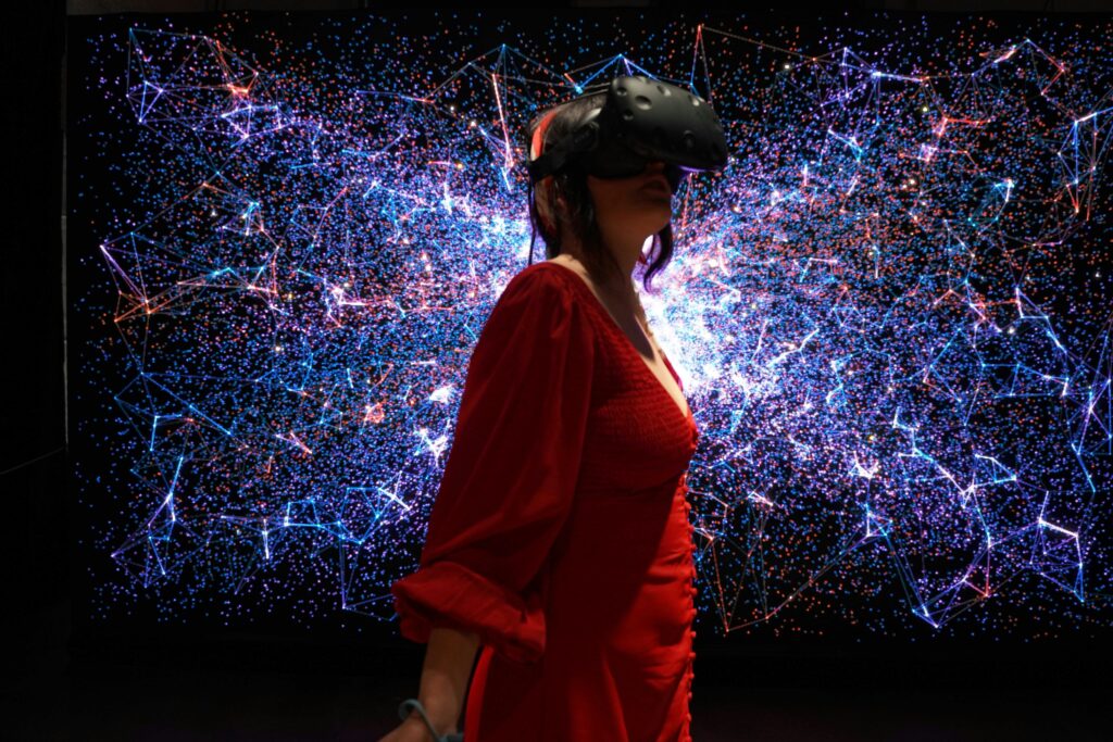 A woman in a red dress wearing a VR headset