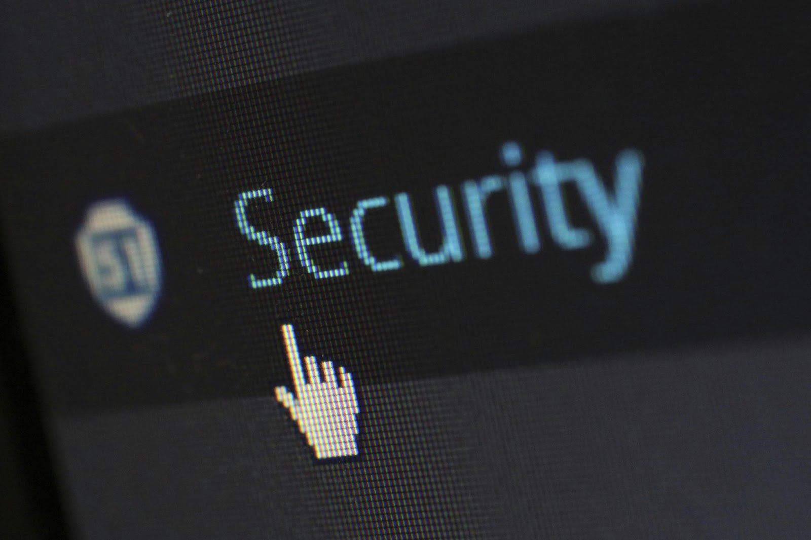 a computer pointer on a computer screen pointing the word Security