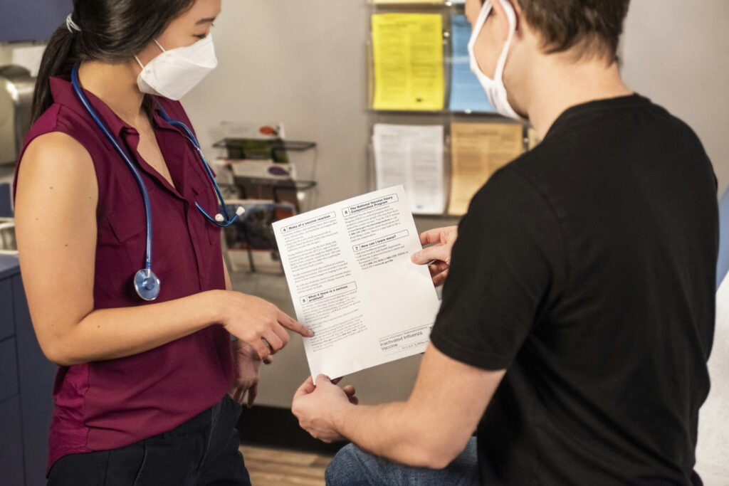 two people reading policy