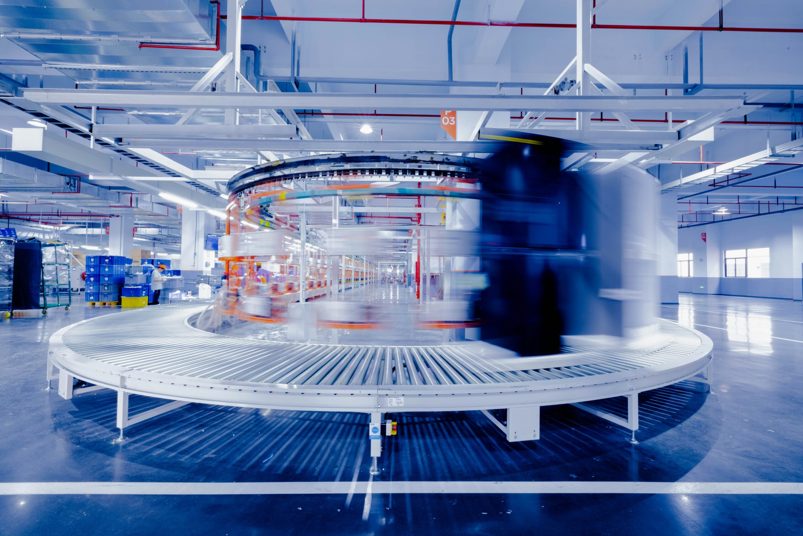 movement of refrigerators being transported on the assembly line inside the Homa refrigerator factory.